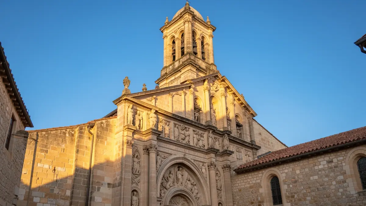 Generic image of a historic stone church facade with a tower and architectural details, under a blue sky.